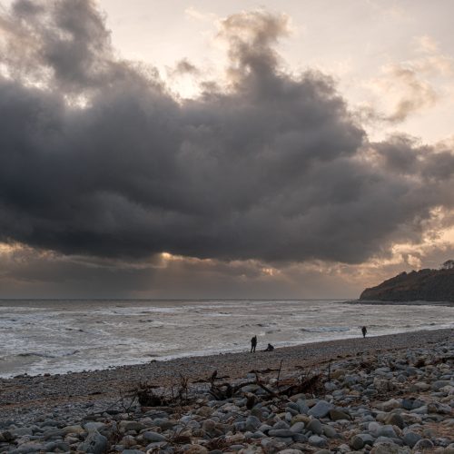 Backlit sunset cloudscape over the sea and coastline from Monmouth Beach Lyme Regis 31_12_24