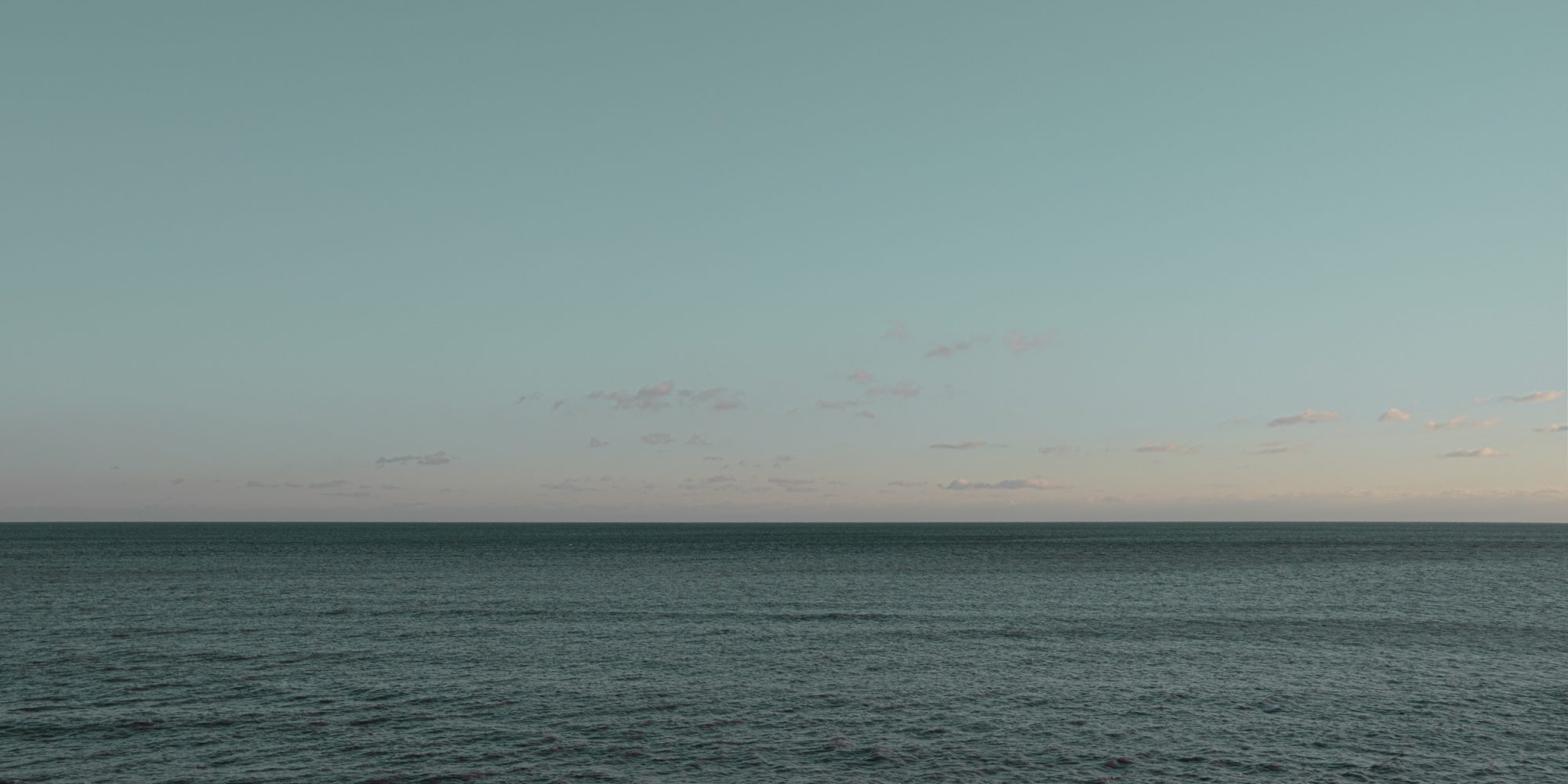 Blue sky and small clouds over the sea from Cart Road Lyme Regis 11_01_24 pano