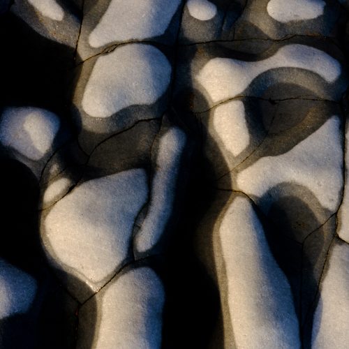 Low sunlight over rock pools on Church Cliff Walk beach, Lyme Regis 13_01_23-2